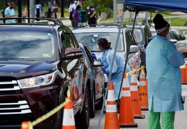 A center offering drive-through and walk-up coronavirus tests in Arlington, Va. Positive test rates in the Washington area remain above 10 percent.